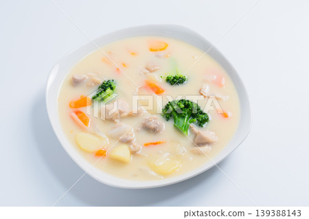 Cream stew, a hearty stew with chicken and vegetables, on a white background. Cream stew, a hearty stew with chicken and vegetables, on a white background. 139388143