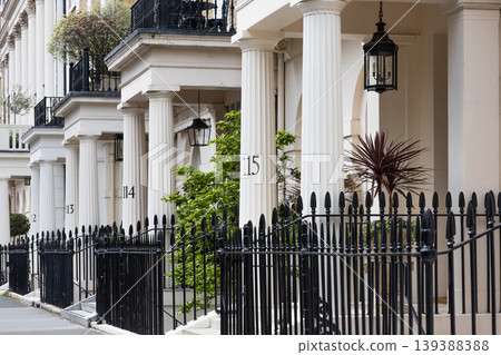 Elegant white townhouses with black iron railings in London Elegant white townhouses with black iron railings in London 139388388