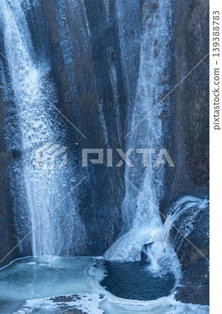 Fukuroda Falls: Multiple streams of water cascading down a frozen rock face (vertical composition) Fukuroda Falls: Multiple streams of water cascading down a frozen rock face (vertical composition) 139388783