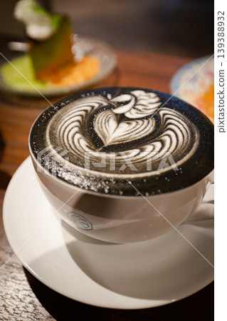 Cafe drink with black latte art: The art of charcoal latte Cafe drink with black latte art: The art of charcoal latte 139388932