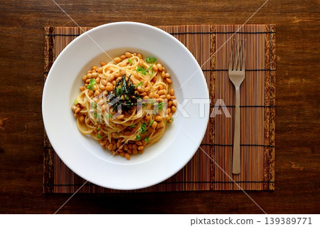 Natto pasta in a table background, viewed from directly above. Natto pasta in a table background, viewed from directly above. 139389771
