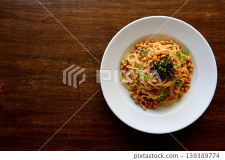 Natto pasta in a table background, viewed from directly above. Natto pasta in a table background, viewed from directly above. 139389774