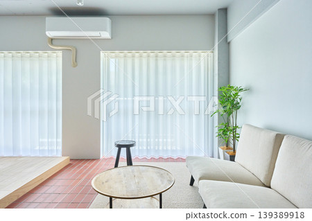 Interior with a sofa by the window 139389918