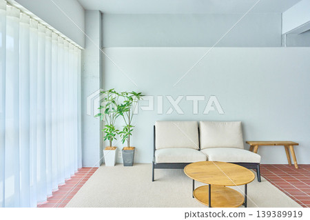 Interior with a sofa by the window Interior with a sofa by the window 139389919