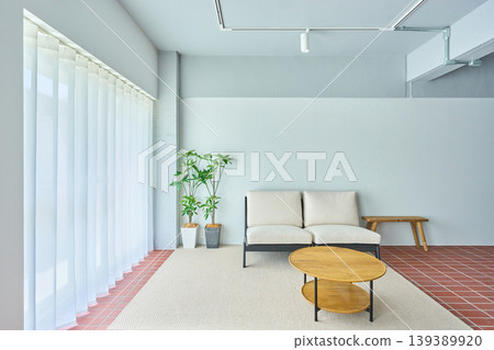 Interior with a sofa by the window 139389920