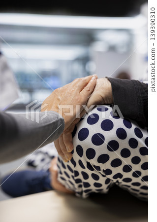Close up of woman medical expert encouraging old person with illness in laboratory, making progress in healthcare and bioscience innovation. Reassuring and consoling man during clinical trial. Close up of woman medical expert encouraging old person with illness in laboratory, making progress in healthcare and bioscience innovation. Reassuring and consoling man during clinical trial. 139390310