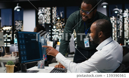 African american staff members use AI chatbot system at pc for problem solving tasks, futuristic high tech highlighting smart algorithms and deep learning. Communication and IT support. 139390361