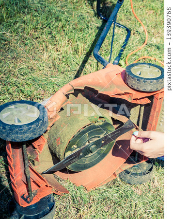 Person having problem with land mower Person having problem with land mower 139390768