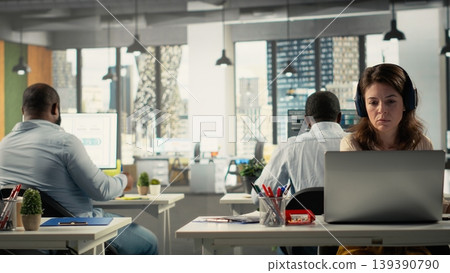 Diverse staff members in office working on forecasting insights. Professional employees review visual data and diagrams to enhance effective management and business goals. Diverse staff members in office working on forecasting insights. Professional employees review visual data and diagrams to enhance effective management and business goals. 139390790