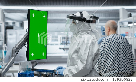 Vertical isolated mockup next to doctor treating patient with severe infection in hazmat suit, using laboratory testing and diagnostic tools to study disease and prevent global disaster. Camera B. Vertical isolated mockup next to doctor treating patient with severe infection in hazmat suit, using laboratory testing and diagnostic tools to study disease and prevent global disaster. Camera B. 139390825