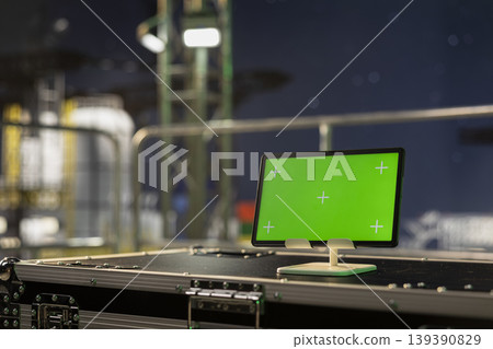 Green screen mockup tablet on offshore platform used for monitoring anomaly detection at night. Chroma key device on drilling ship deck used for managing subsea systems, close up shot Green screen mockup tablet on offshore platform used for monitoring anomaly detection at night. Chroma key device on drilling ship deck used for managing subsea systems, close up shot 139390829