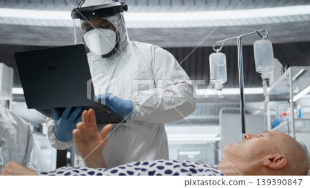 Scientists working in a virology unit with lab testing on infected patient, studying bacteria and immune response for disease prevention and treatment breakthrough. Prevention center. Camera A. Scientists working in a virology unit with lab testing on infected patient, studying bacteria and immune response for disease prevention and treatment breakthrough. Prevention center. Camera A. 139390847