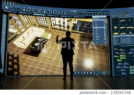 Architect uses virtual reality tech to design modern living room interior in CAD program. Designer holding VR controller interacts with 3D architectural model on large screen Architect uses virtual reality tech to design modern living room interior in CAD program. Designer holding VR controller interacts with 3D architectural model on large screen 139391146
