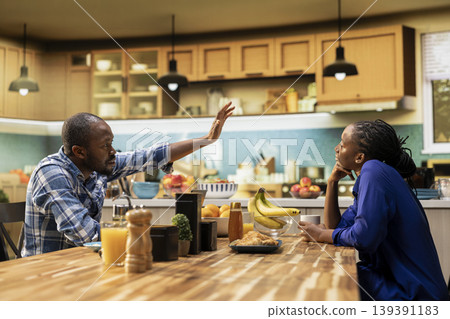 African american guy trying to catch attention of absent zoned out lover, detached woman being defocused and dissociated from her boyfriend over morning coffee. Disconnected girl. 139391183