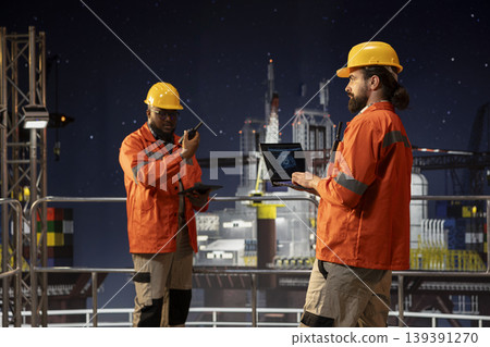 Offshore sea platform technicians using deep learning artificial intelligence to optimize drilling precision. Drilling rig crew monitors equipment performance using AI neural networks tracking system Offshore sea platform technicians using deep learning artificial intelligence to optimize drilling precision. Drilling rig crew monitors equipment performance using AI neural networks tracking system 139391270
