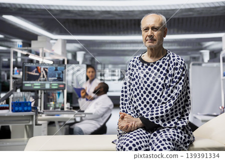Portrait of male patient sitting in the research laboratory for clinical trial, waiting for vitals examination and consultation. Older man kept under observation as a RD strategy. Portrait of male patient sitting in the research laboratory for clinical trial, waiting for vitals examination and consultation. Older man kept under observation as a RD strategy. 139391334