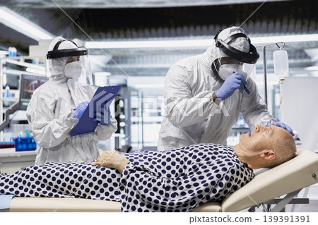 Medical scientist working in a virology unit with lab testing on contagious man, studying bacteria and immune response for disease prevention and treatment breakthrough. Prevention center. Medical scientist working in a virology unit with lab testing on contagious man, studying bacteria and immune response for disease prevention and treatment breakthrough. Prevention center. 139391391