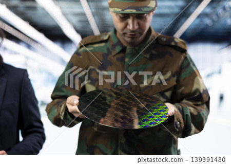 Manufacturing semiconductors, chip war and military intelligence officer with manager. Brainstorming, silicon wafers and industrial plant director with soldier upgrading defense equipment Manufacturing semiconductors, chip war and military intelligence officer with manager. Brainstorming, silicon wafers and industrial plant director with soldier upgrading defense equipment 139391480