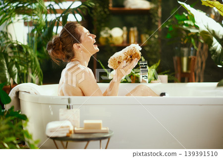 Laughing Woman\'s Blissful Bubble Bath Moment Laughing Woman\'s Blissful Bubble Bath Moment 139391510