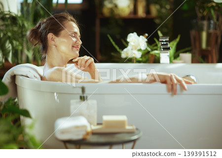 Blissful Woman Embracing Serenity in Bath Blissful Woman Embracing Serenity in Bath 139391512
