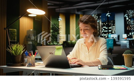 Tactical businesswoman getting a new clever idea at night time, visionary person with ingenuity and originality. Brilliant woman discovering a solution, breakthrough for growth. Camera A. Tactical businesswoman getting a new clever idea at night time, visionary person with ingenuity and originality. Brilliant woman discovering a solution, breakthrough for growth. Camera A. 139391595
