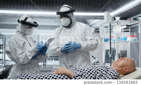 Scientists working in a virology unit with lab testing on infected patient, studying bacteria and immune response for disease prevention and treatment breakthrough. Prevention center. Camera B. Scientists working in a virology unit with lab testing on infected patient, studying bacteria and immune response for disease prevention and treatment breakthrough. Prevention center. Camera B. 139391665