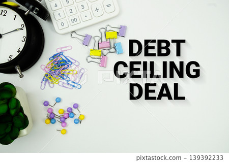 Debt Ceiling Deal message with calculator, alarm clock and Stationery on white background Debt Ceiling Deal message with calculator, alarm clock and Stationery on white background 139392233
