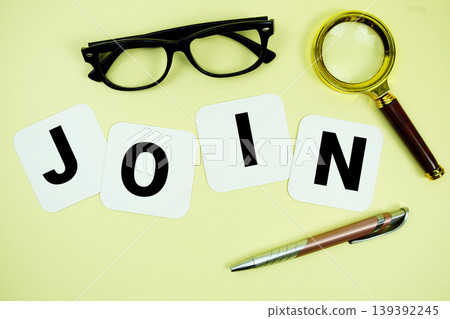JOIN alphabet letters with magnifying glass, eye glasses and pen on yellow background JOIN alphabet letters with magnifying glass, eye glasses and pen on yellow background 139392245