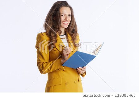 Focused Businesswoman with Notebook and Pen 139393465