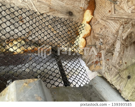 Installing leaf guard mesh in gutter Installing leaf guard mesh in gutter 139393585