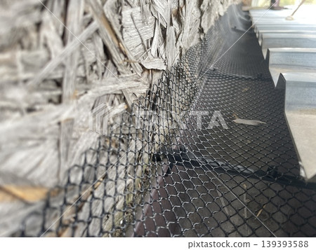 Installing leaf guard mesh in gutter Installing leaf guard mesh in gutter 139393588