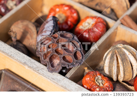 Detail of fragrant potpourri with lotus pod and botanicals assortment Close up Detail of fragrant potpourri with lotus pod and botanicals assortment Close up 139393723