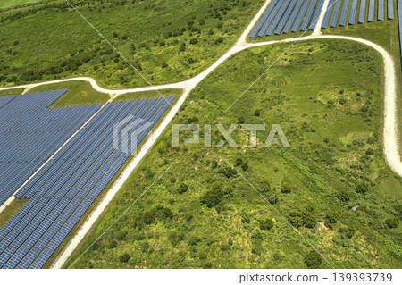Aerial view of big sustainable electric power plant with many rows of solar photovoltaic panels for producing clean electrical energy. Renewable electricity with zero emission concept 139393739