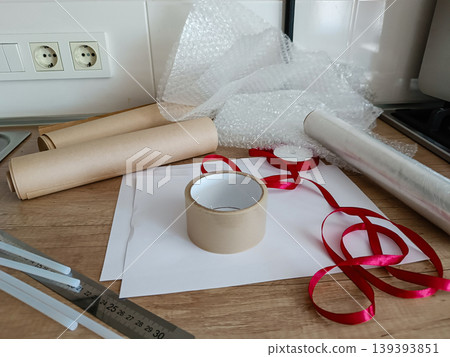 Packing and Shipping Supplies on Wooden Table Packing and Shipping Supplies on Wooden Table 139393851