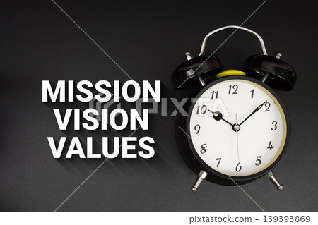 Mission Vision Values text with alarm clock on black background Mission Vision Values text with alarm clock on black background 139393869