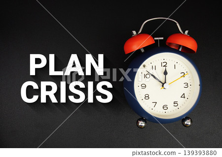 Plan Crisis text with alarm clock on black background Plan Crisis text with alarm clock on black background 139393880