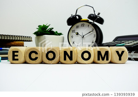 ECONOMY alphabet letters with alarm clock and calculator on white background 139393939