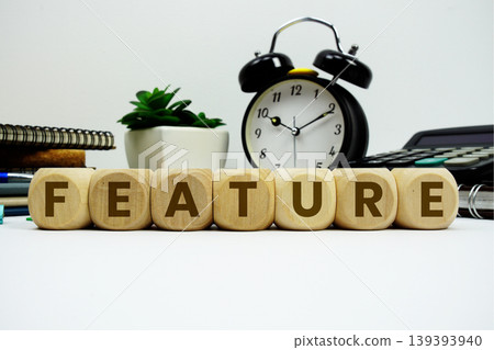 FEATURE alphabet letters with alarm clock and calculator on white background FEATURE alphabet letters with alarm clock and calculator on white background 139393940