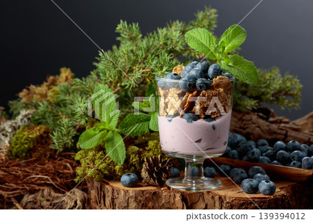 Blueberry dessert with rye flakes and fresh berries. 139394012