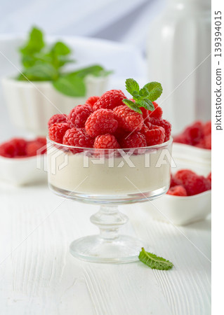 Panna cotta with fresh raspberries. Panna cotta with fresh raspberries. 139394015