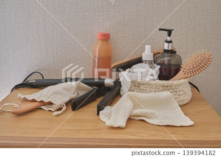 Hair care products and tools on wooden table Hair care products and tools on wooden table 139394182