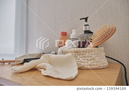 Self-care essentials with hair brush and beauty products 139394189