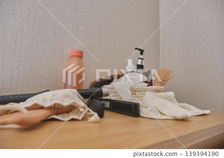 Hair care health and beauty products on wooden dresser 139394190