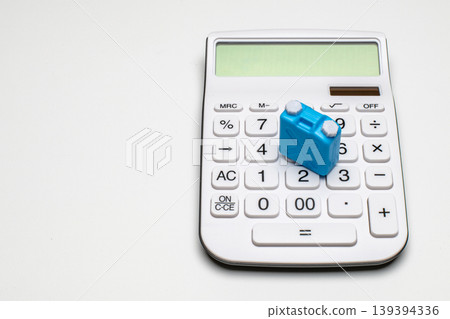 The image of rising fuel prices is conveyed by the blue plastic container and calculator. The image of rising fuel prices is conveyed by the blue plastic container and calculator. 139394336