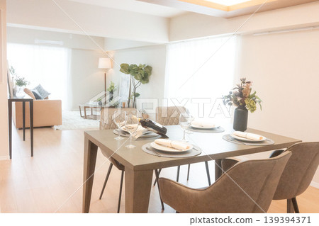 Real estate advertising material: A view of a sunny living room and a functional kitchen. Real estate advertising material: A view of a sunny living room and a functional kitchen. 139394371