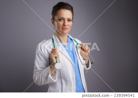 Professional Female Physician Holding Stethoscope Professional Female Physician Holding Stethoscope 139394541