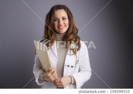 Confident Doctor with Medical Clipboard Confident Doctor with Medical Clipboard 139394555