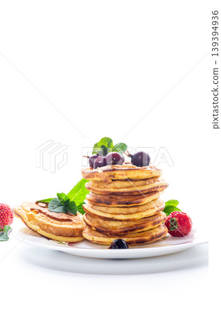 Homemade pancakes with strawberry and grapes on clean white background 139394936