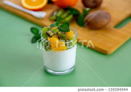 fresh organic yogurt with kiwi and citrus orange topping fresh organic yogurt with kiwi and citrus orange topping 139394944