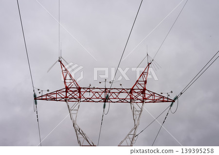 High-voltage power lines against the background of cloudy sky 139395258